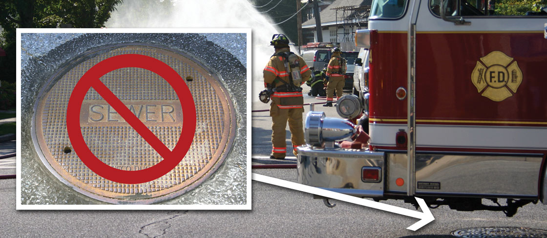 Fire truck parked over manhole cover