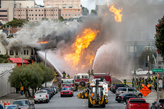 Firefighters fighting gas line explosion